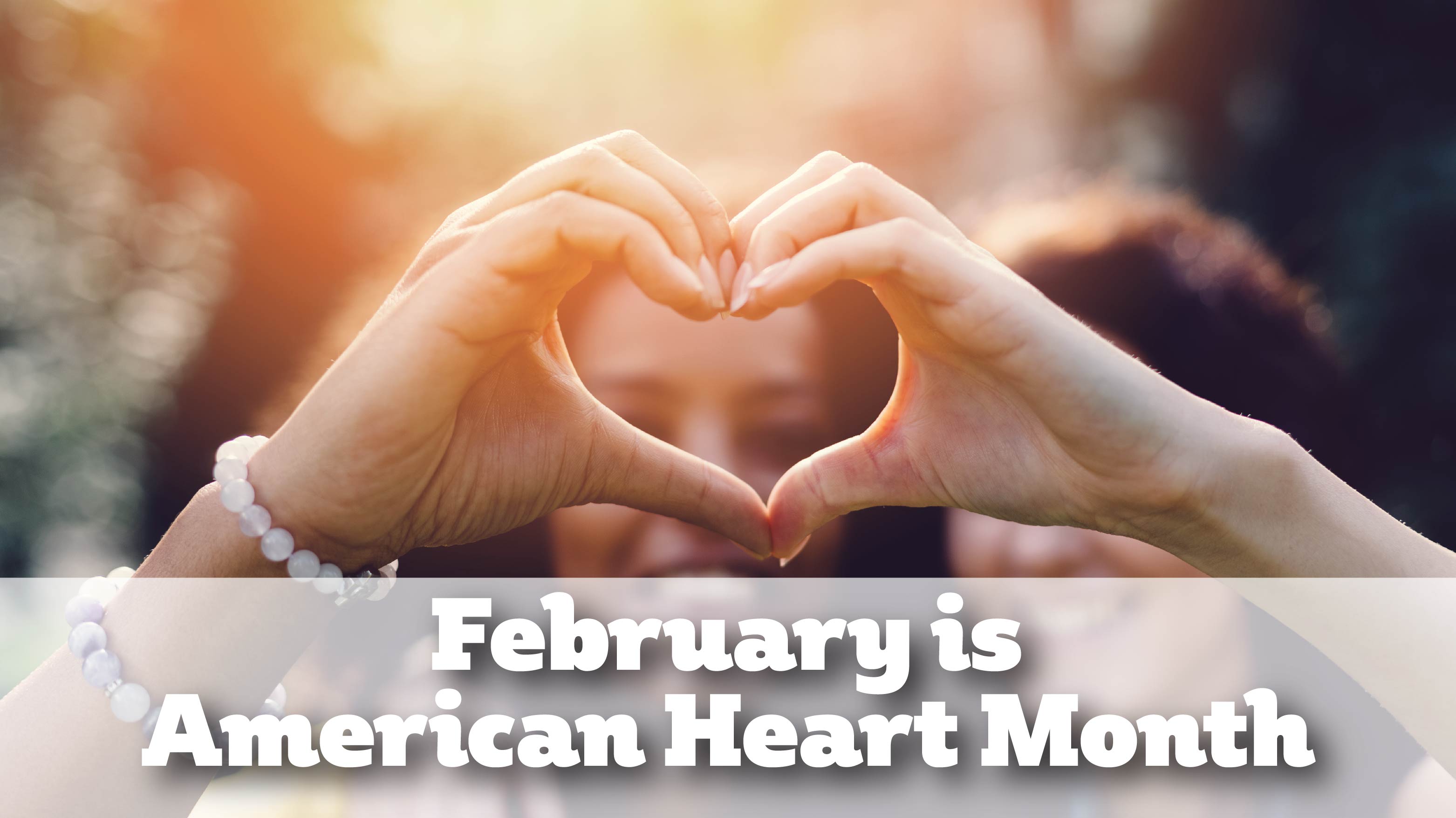 image of hands forming a heart with the words February is American heart month