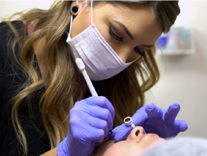 image of a licensed person performing microblading on a customer