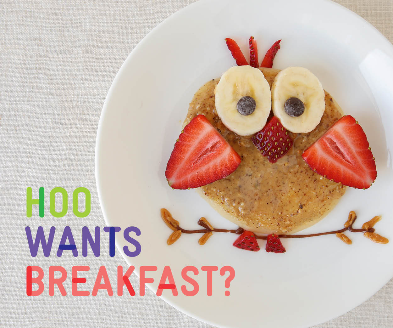 image of an owl made of food with the words hoo wants breakfast?